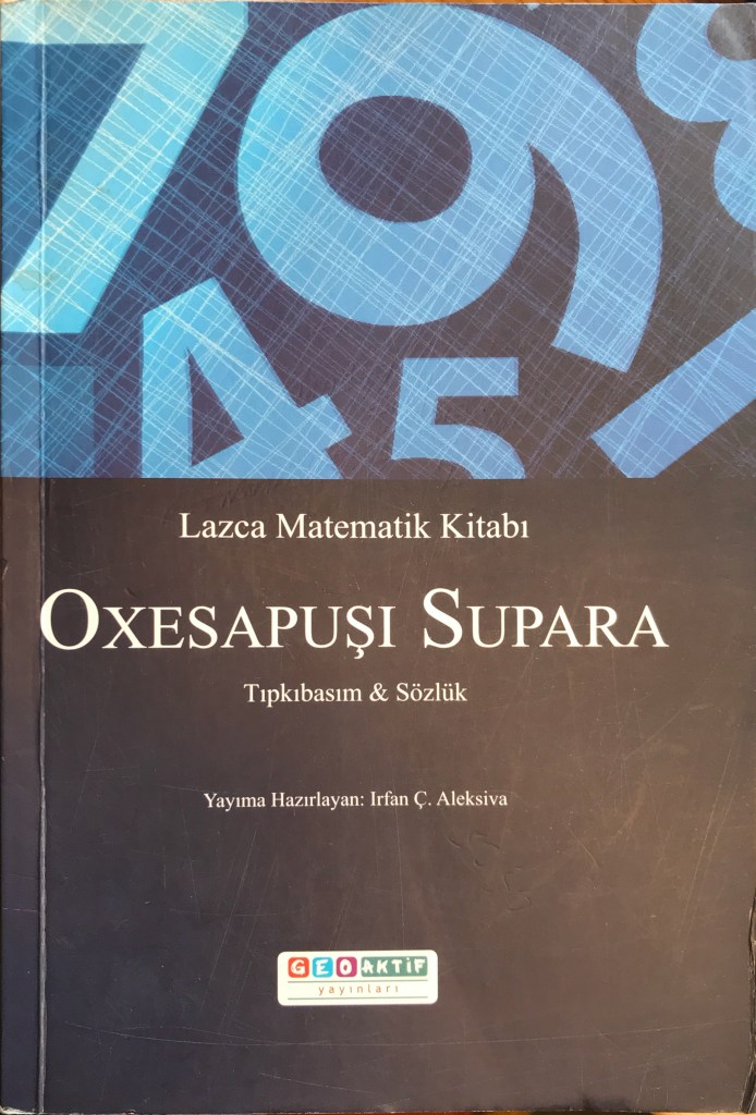 Cover of book with large numerals in blue at top and text in white on black background below.