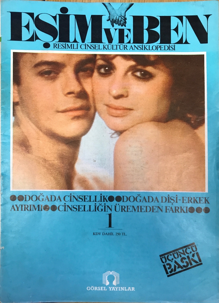 Magazine cover with colour photograph of man and woman with faces pressed against one another, both naked, above all-capitals text in black ink. 