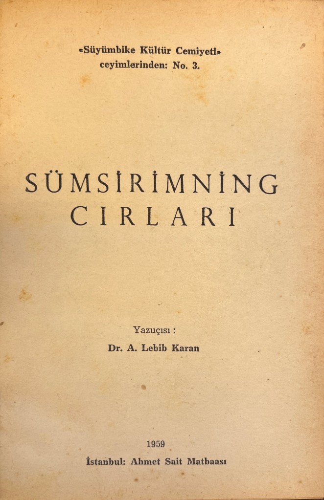 Cream-coloured page with text in black ink in Latin script at the top, middle, and bottom of the page.