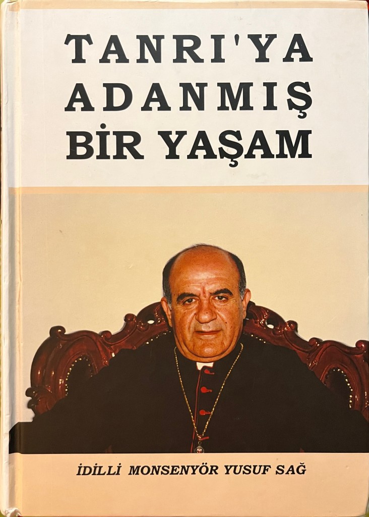 Book cover with black text at top above portrait of seated priest on an elaborate carved chair