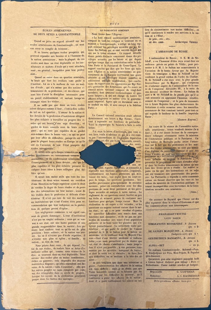 A yellowed sheet of newspaper with three columns of Latin-script text in black ink, missing a small piece in the centre of the sheet