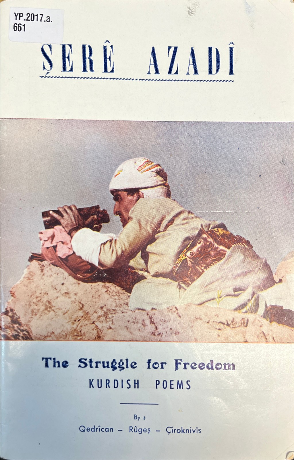 Faded colour image of a man in Kurdih dress crouched on a rocky outcropping holding binoculars. Above is a large all-caps title in blue in Latin script and below are four lines of Latin-script text in blue