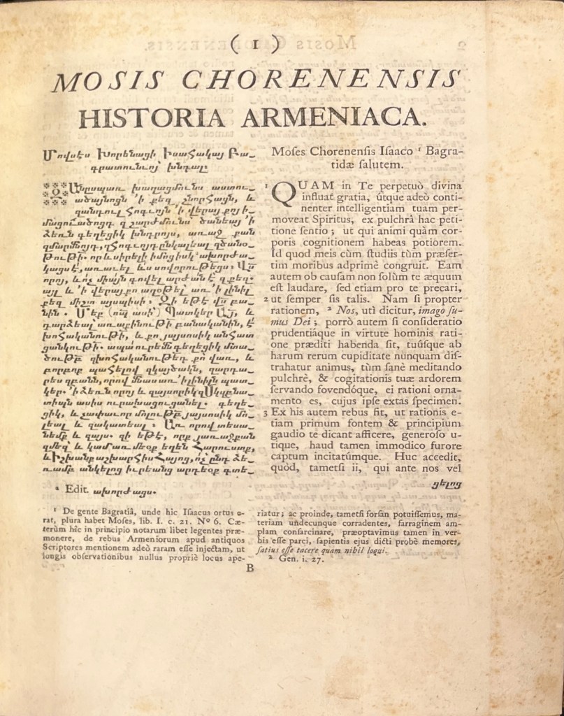Cream page of paper with text in black ink, a single column in large font at the top and two smaller columns below, the left in Armenian script and the right in Latin script.