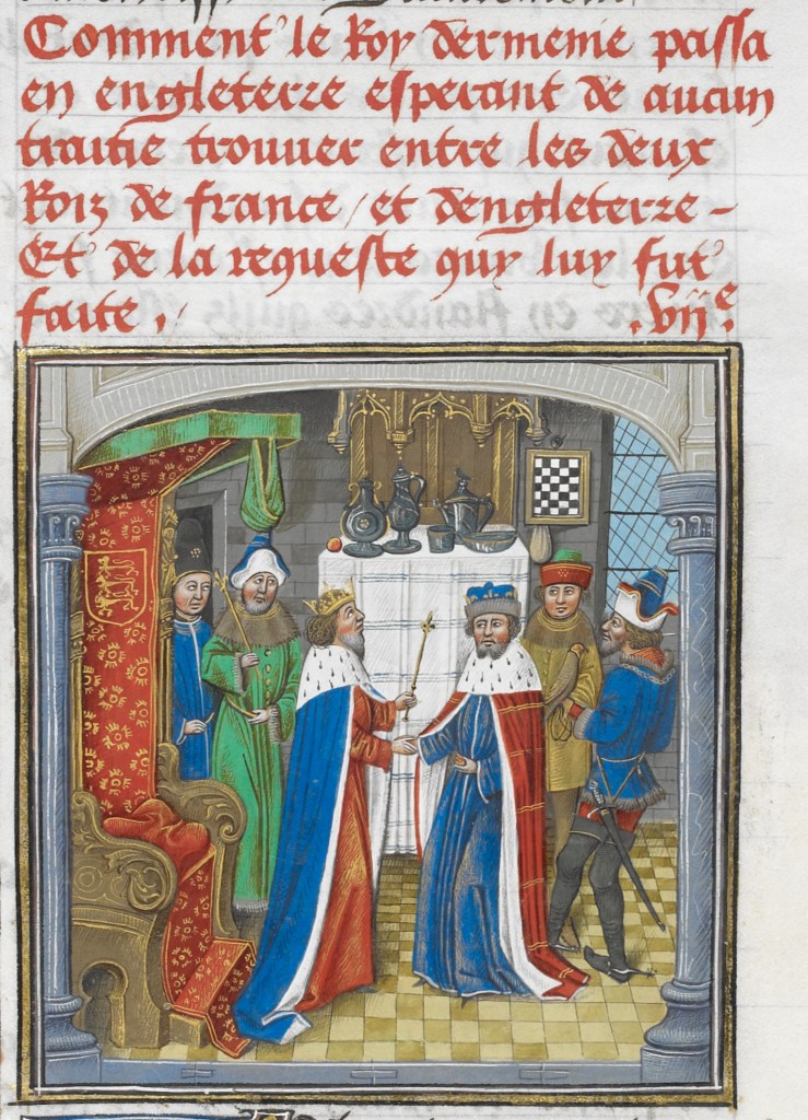 A white sheet of parchment with five lines of Medieval French text in red ink above a small painting of two men in cloaks and gowns in red and blue in the foreground. In the background is a table with crockery and a white tablecloths and there are rich Medieval furnishings around it, with four courtiers in Medieval dress